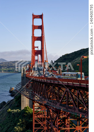 Golden Gate Bridge tower with traffic above San Francisco Bay 140400795