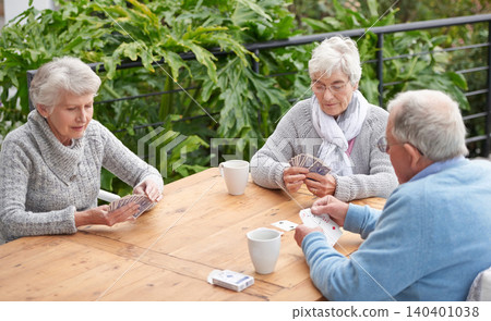 Elderly people, card games and coffee at table with outdoor background for retirement and old age. Group, seniors or family with beverages and thinking for poker, relax and break together on patio Elderly people, card games and coffee at table with outdoor background for retirement and old age. Group, seniors or family with beverages and thinking for poker, relax and break together on patio 140401038
