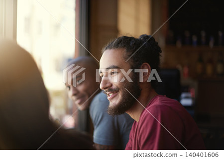 Face, smile and man with friends in coffee shop together for conversation or bonding on weekend. Customer, relax and summer with group of happy young friends in cafe or restaurant for time off 140401606
