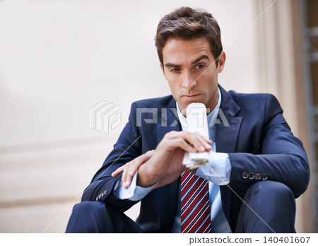 Businessman, thinking and newspaper for ideas for corporate company in city as employee of business. Man, ambitious and sitting on street and thoughtful about stocks information on finance of work 140401607