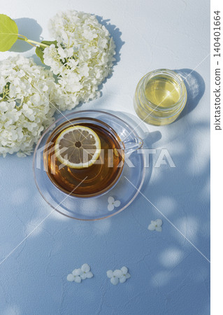 A refreshing tea time with Annabelle hydrangeas and lemon tea in early summer. A refreshing tea time with Annabelle hydrangeas and lemon tea in early summer. 140401664