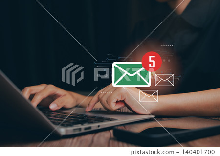 Email concept. Hands typing on a laptop with digital email notifications for communication and productivity concepts Email concept. Hands typing on a laptop with digital email notifications for communication and productivity concepts 140401700