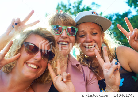 Peace, group and selfie outdoor for holiday, photography and women for portrait. Nature, friends and blue sky in summer, vacation and happy with getaway and excited with a smile and finger gesture 140401743