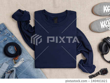 Blank dark blue unisex sweatshirt mockup, folded crewneck flat lay with denim and mens accessories Blank dark blue unisex sweatshirt mockup, folded crewneck flat lay with denim and mens accessories 140401821