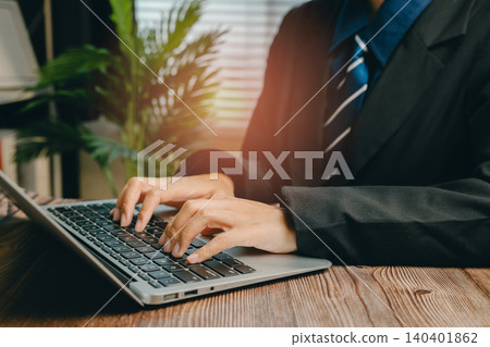 Business Professional Working on Laptop in Modern Office Environment with Natural Light, Business concept Business Professional Working on Laptop in Modern Office Environment with Natural Light, Business concept 140401862
