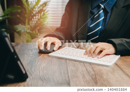Professional Businessman Working on Computer Keyboard in Modern Office Environment, Business concept Professional Businessman Working on Computer Keyboard in Modern Office Environment, Business concept 140401884
