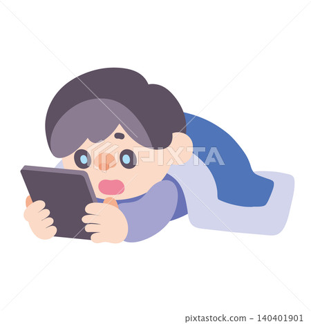 A boy using a tablet while lying down A boy using a tablet while lying down 140401901