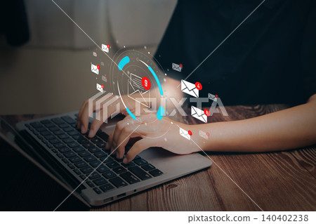 Email notification overload concept. Person typing on laptop with floating message icons, digital communication stress, inbox management, productivity challenge, online work pressure. Email notification overload concept. Person typing on laptop with floating message icons, digital communication stress, inbox management, productivity challenge, online work pressure. 140402238