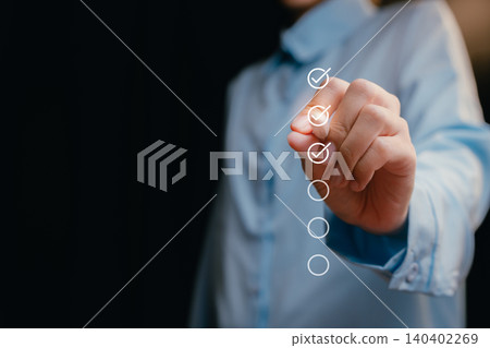 Hand With Checkmarks Completing Tasks on Digital Checklist Board, business concept Hand With Checkmarks Completing Tasks on Digital Checklist Board, business concept 140402269