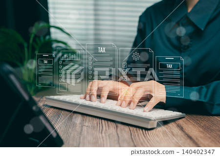 Woman typing tax documents at a modern workspace, Business concept Woman typing tax documents at a modern workspace, Business concept 140402347