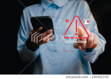 System Warning concept. User Interacting with Smartphone Displaying Cybersecurity System Warning Alert Notification System Warning concept. User Interacting with Smartphone Displaying Cybersecurity System Warning Alert Notification 140402370