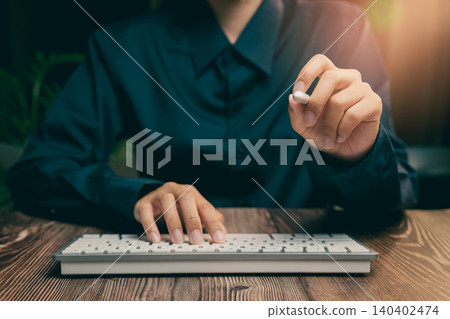 Focused Business Professional Using Keyboard with a Stylus in Modern Workspace Environment, Business concept 140402474