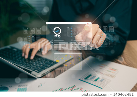 Business Professional Analyzing Data with Technology in Office Setting, business concept. 140402491