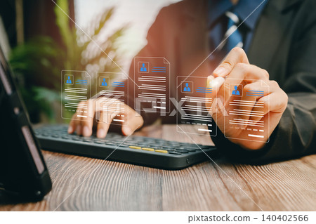 Business professional managing digital files and documents on a computer, showcasing modern technology and productivity 140402566