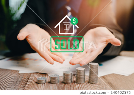 Sold House Concept. Businessman Presenting Sold House Concept with Stacked Coins and Financial Symbols for Real Estate Success Sold House Concept. Businessman Presenting Sold House Concept with Stacked Coins and Financial Symbols for Real Estate Success 140402575