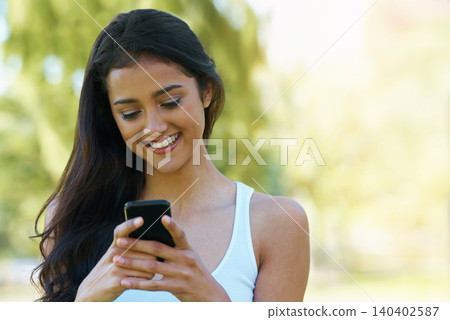 Happy, woman and reading outdoor with phone to post on social media for communication. Virtual, chat and college student in woods with smartphone for networking, connection and contact in park mockup 140402587