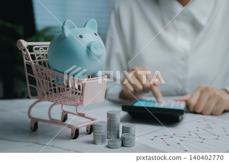 Savings concepts with piggy bank and financial tools, Business concept Savings concepts with piggy bank and financial tools, Business concept 140402770