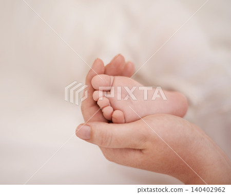 Feet, hand and parents with infant, support and love of parent for bonding or wellness. Family, close up of caring person holding baby toes for security, protection and childhood development 140402962
