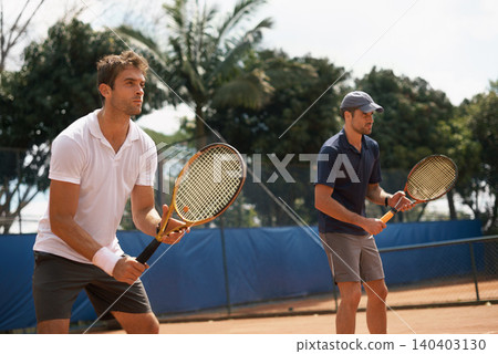 Fitness, sports or tennis and doubles team with men on court for competition, game or match together. Exercise, partner and training with confident young athlete people outdoor in summer for action Fitness, sports or tennis and doubles team with men on court for competition, game or match together. Exercise, partner and training with confident young athlete people outdoor in summer for action 140403130