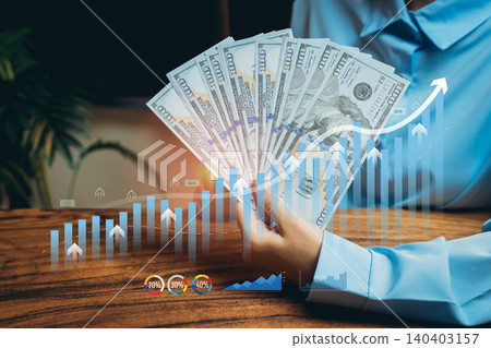 Hands Holding Currency with Financial Graphs and Positive Trends in Business Investment and Growth Concepts, Business concept 140403157