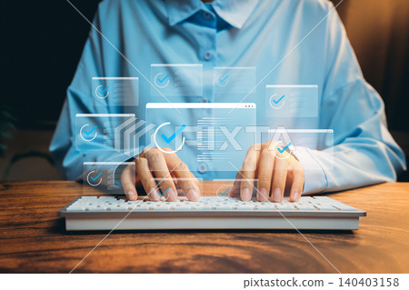 Hands Typing on Keyboard Surrounded by Digital Checkmarks and User Interface Elements in a Modern Workspace, Business concept 140403158