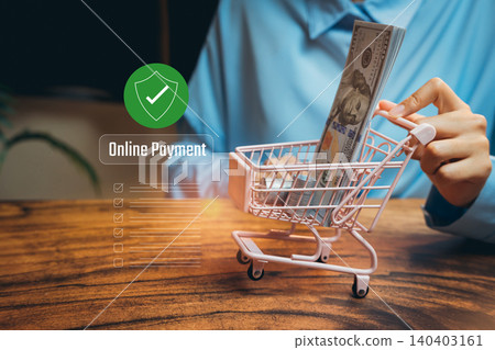 Online Payment Concept with Shopping Cart and Cash in Hand for E-commerce and Digital Transactions, Business concept Online Payment Concept with Shopping Cart and Cash in Hand for E-commerce and Digital Transactions, Business concept 140403161