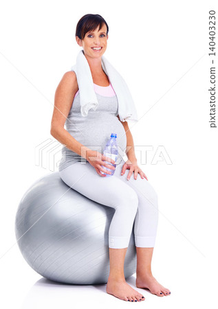 Pregnant female person, fitness and ball for studio, wellness and exercise for motherhood in pregnancy. Maternal woman, water and white background for health, maternity and towel to keep in shape Pregnant female person, fitness and ball for studio, wellness and exercise for motherhood in pregnancy. Maternal woman, water and white background for health, maternity and towel to keep in shape 140403230