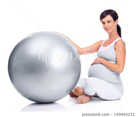 Pregnant female person, ball and studio for final trimester, wellness and exercise for motherhood. Maternal woman, workout and white background for health, fitness and pregnancy to keep in shape Pregnant female person, ball and studio for final trimester, wellness and exercise for motherhood. Maternal woman, workout and white background for health, fitness and pregnancy to keep in shape 140403231