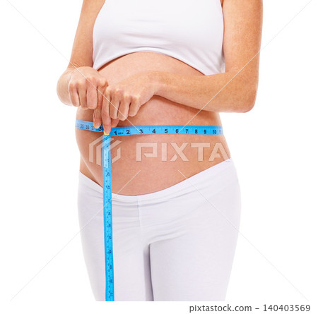 Woman, hands and pregnant with measure for growth in studio on white background for wellness and health. Closeup, female person and mother on maternity with pregnancy, stomach and future family Woman, hands and pregnant with measure for growth in studio on white background for wellness and health. Closeup, female person and mother on maternity with pregnancy, stomach and future family 140403569