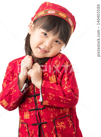 A portrait of an Asian girl in ethnic minority clothing standing against a white background. A portrait of an Asian girl in ethnic minority clothing standing against a white background. 140403589