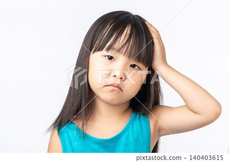 Frustrated Asian girl holding her head, feeling bored, tired or having a headache. 140403615