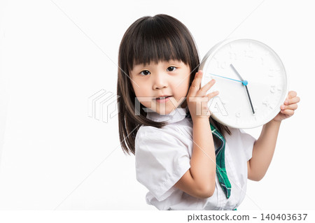 Surprised school girl holding a white clock, concept of being late or time management. 140403637