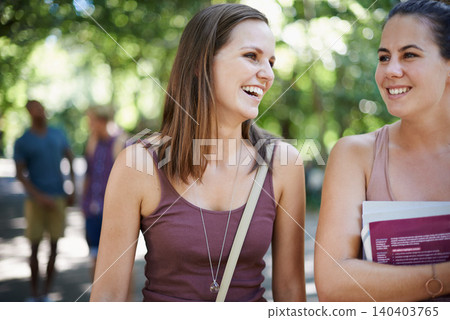 Happy, friends and students on campus with education, learning and talking of knowledge in university. Young women laughing or excited at park or college for scholarship, studying and collaboration 140403765