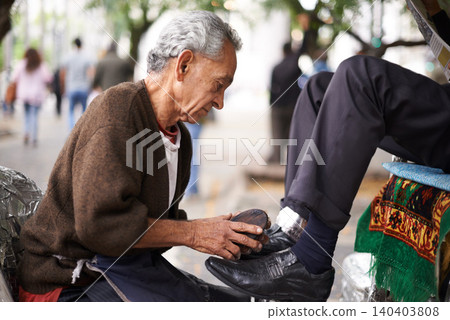 Shoe cleaner, elderly man person and shining feet, small business owner and professional on busy street. Mature, senior male and experienced worker from Puerto Rico, working with brush in city Shoe cleaner, elderly man person and shining feet, small business owner and professional on busy street. Mature, senior male and experienced worker from Puerto Rico, working with brush in city 140403808