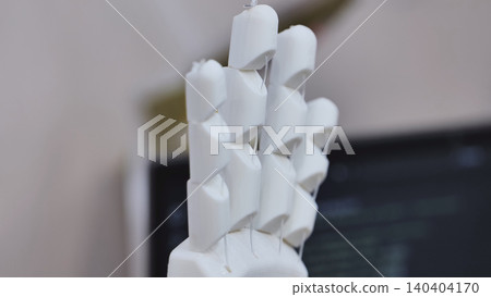 3D printing white robotic prosthesis hand in a technology exhibition 3D printing white robotic prosthesis hand in a technology exhibition 140404170
