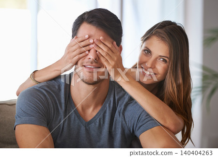 Portrait, smile and couple with surprise in home, love and happy people bonding together for romance. Face, man and woman covering eyes for connection, care and healthy relationship in living room Portrait, smile and couple with surprise in home, love and happy people bonding together for romance. Face, man and woman covering eyes for connection, care and healthy relationship in living room 140404263