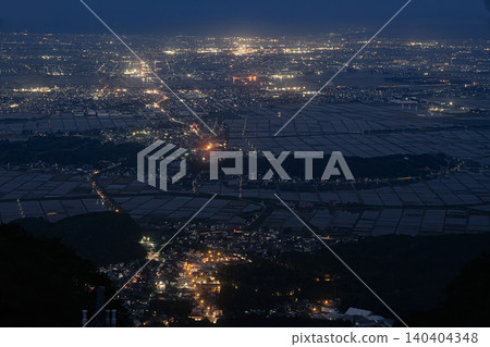 The night view of the Echigo Plain and the large torii gate, seen from Mount Yahiko. 140404348
