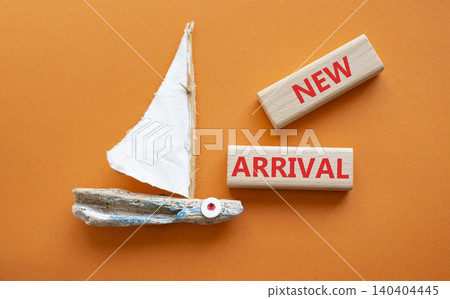 NEW ARRIVAL symbol. Concept word NEW ARRIVAL on wooden blocks. Beautiful orange background with boat. Business and NEW ARRIVAL concept. Copy space NEW ARRIVAL symbol. Concept word NEW ARRIVAL on wooden blocks. Beautiful orange background with boat. Business and NEW ARRIVAL concept. Copy space 140404445