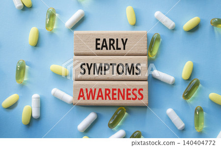 Early symptoms awareness symbol. Concept words Early symptoms awareness on wooden blocks. Beautiful blue background with pills. Healthcare and Early symptoms awareness concept. Copy space. Early symptoms awareness symbol. Concept words Early symptoms awareness on wooden blocks. Beautiful blue background with pills. Healthcare and Early symptoms awareness concept. Copy space. 140404772