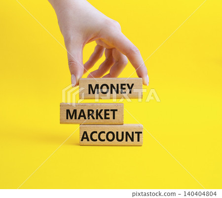 Money Market Account symbol. Wooden blocks with words Money Market Account. Businessman hand. Beautiful yellow background. Business and Money Market Account concept. Copy space. Money Market Account symbol. Wooden blocks with words Money Market Account. Businessman hand. Beautiful yellow background. Business and Money Market Account concept. Copy space. 140404804