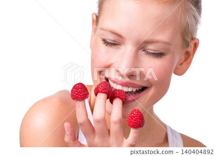 Smile, funny and woman eating raspberries, fingers and wellness isolated on white studio background. Person, mockup space or model with fruit and playful with nutrition, fresh or happy with health Smile, funny and woman eating raspberries, fingers and wellness isolated on white studio background. Person, mockup space or model with fruit and playful with nutrition, fresh or happy with health 140404892