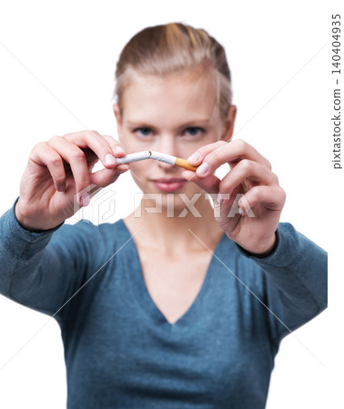 Studio, portrait and woman with broken cigarette to quit tobacco for health, wellness and results. White background, girl and stop smoking for healthcare benefits, commitment and addiction support. 140404935