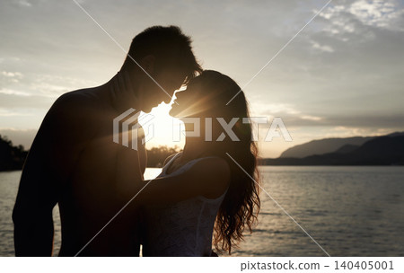 Silhouette, couple and love by ocean at sunset, vacation or travel together in summer. Man, woman and romance at sea with shadow for connection, relationship and adventure by water outdoor in nature Silhouette, couple and love by ocean at sunset, vacation or travel together in summer. Man, woman and romance at sea with shadow for connection, relationship and adventure by water outdoor in nature 140405001