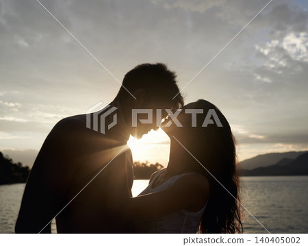 Silhouette, couple and love by sea at sunset, vacation or travel together in summer. Man, woman and romance at ocean with shadow for connection, relationship and commitment by water outdoor in nature Silhouette, couple and love by sea at sunset, vacation or travel together in summer. Man, woman and romance at ocean with shadow for connection, relationship and commitment by water outdoor in nature 140405002
