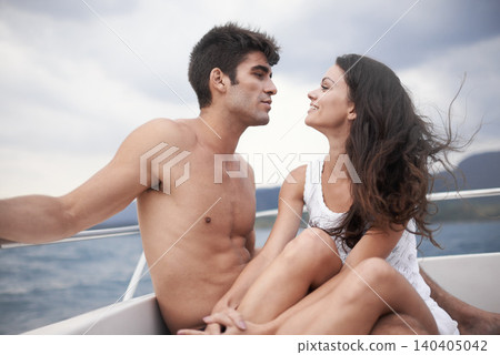 Couple, romance and boat with sea, water and nature for love and summer travel. Man, woman and holiday with adventure, happiness and intimate relationship with date or honeymoon for ocean journey 140405042