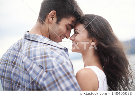 Love, smile and couple at ocean for vacation, holiday or travel together in summer. Happy man, woman and touch face at sea for connection, care and romance on adventure by water outdoor in nature Love, smile and couple at ocean for vacation, holiday or travel together in summer. Happy man, woman and touch face at sea for connection, care and romance on adventure by water outdoor in nature 140405058