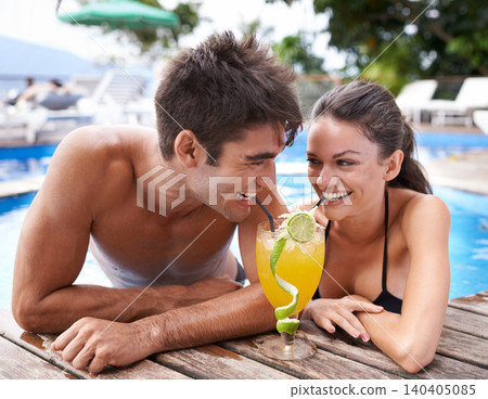 Swimming pool, cocktail and couple with holiday, sunshine and weekend break with happiness, relax and honeymoon. Summer, man or woman with tropical drink or wet with getaway trip or luxury with water Swimming pool, cocktail and couple with holiday, sunshine and weekend break with happiness, relax and honeymoon. Summer, man or woman with tropical drink or wet with getaway trip or luxury with water 140405085