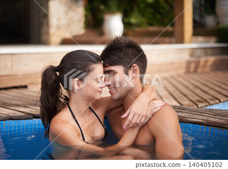 Couple, pool and hug outdoor, love and connection with forehead touch and summer vacation at hotel. Happy people, swimming or relax in jacuzzi for romantic date or getaway with trust and bonding Couple, pool and hug outdoor, love and connection with forehead touch and summer vacation at hotel. Happy people, swimming or relax in jacuzzi for romantic date or getaway with trust and bonding 140405102