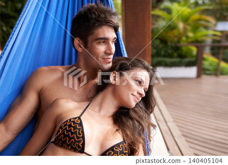 Couple, hammock rest at holiday resort for summer vacation in Hawaii for honeymoon, bonding or stress relief. Man, woman and lodge accommodation at tropical paradise or hotel weekend, travel or break Couple, hammock rest at holiday resort for summer vacation in Hawaii for honeymoon, bonding or stress relief. Man, woman and lodge accommodation at tropical paradise or hotel weekend, travel or break 140405104