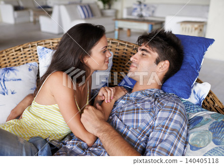 Couple, relax and romantic at home for love, relationship and spouse comfort for security. Man, woman and together in living room for bonding, commitment and cuddle in house for happiness and safety Couple, relax and romantic at home for love, relationship and spouse comfort for security. Man, woman and together in living room for bonding, commitment and cuddle in house for happiness and safety 140405118